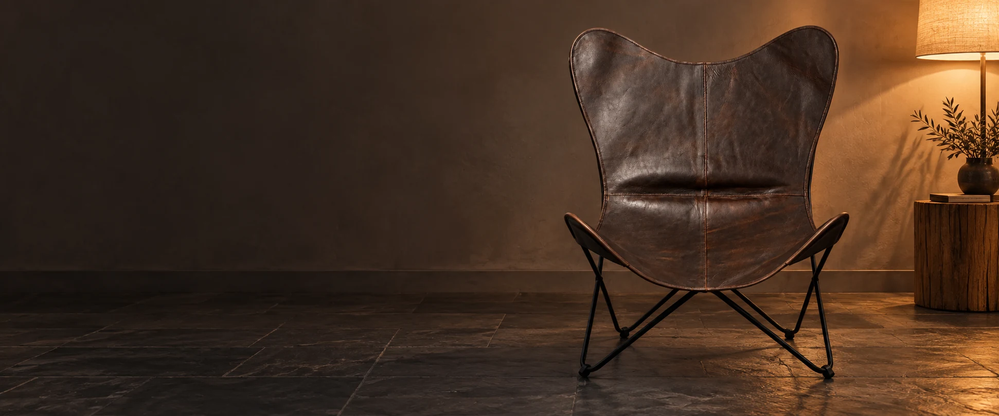 Leather Butterfly Chair Cover styled in an understated home studio with slate flooring