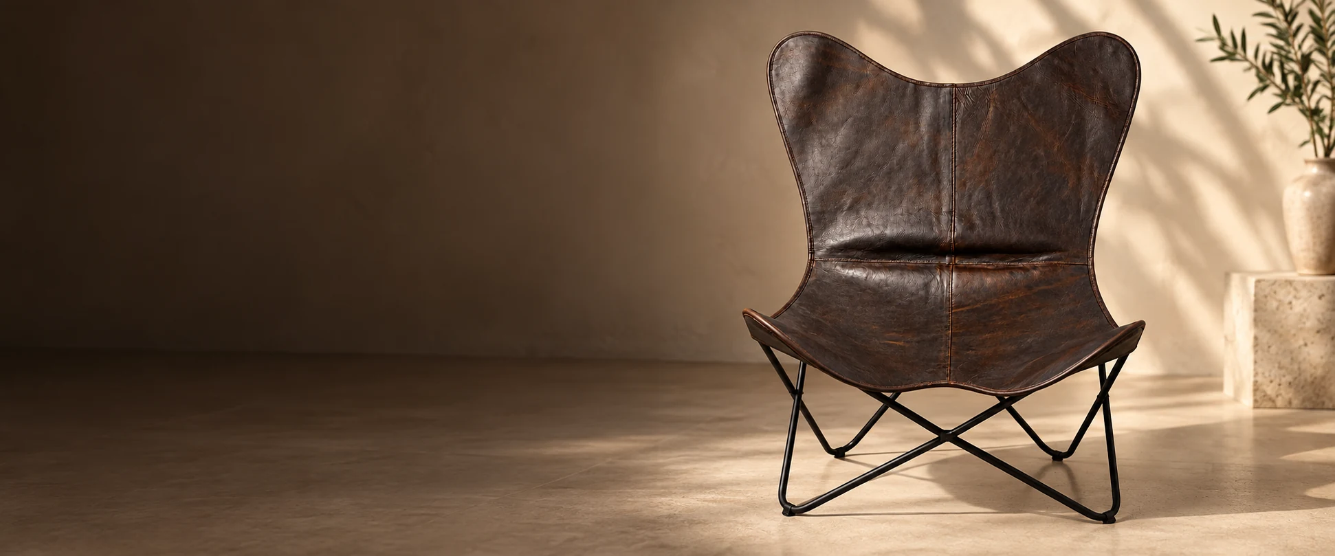 Leather Butterfly Chair Cover styled in a quiet interior studio with warm ivory walls