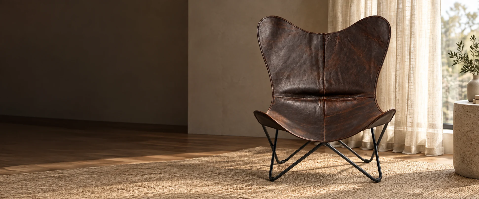 Leather Butterfly Chair Cover styled in a light-filled living room with woven linen curtains