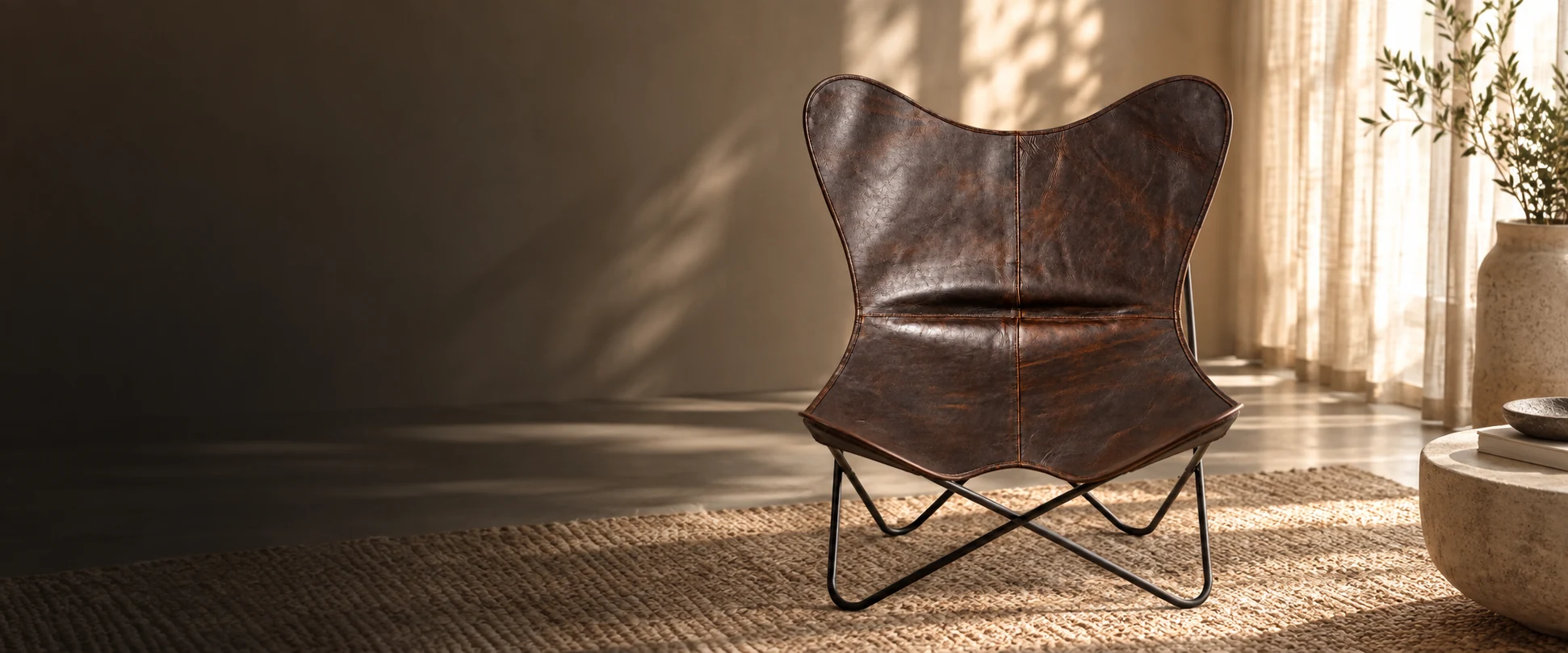 Leather Butterfly Chair Cover styled in a light-filled living room with woven linen curtains